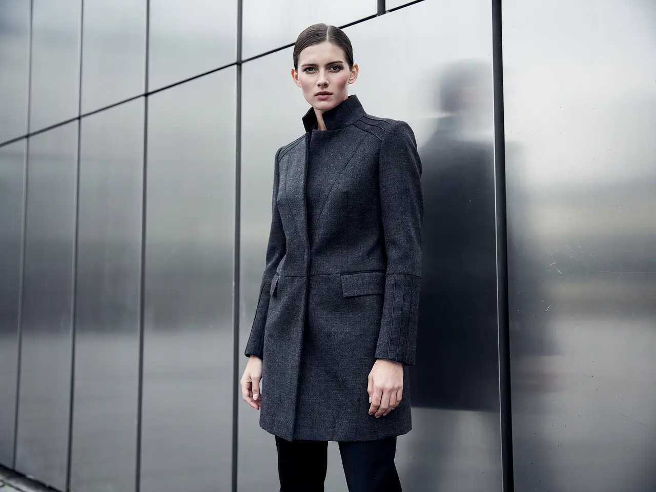 An editorial fashion campaign frame with controlled styling, refined color, and premium lighting.